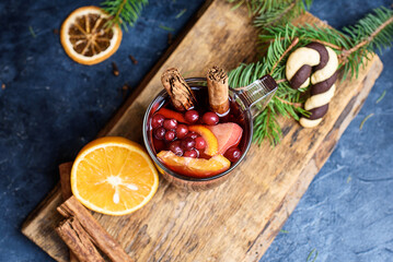 Hot Mulled Wine for winter and Christmas on wooden table with copy space. Red Hot wine