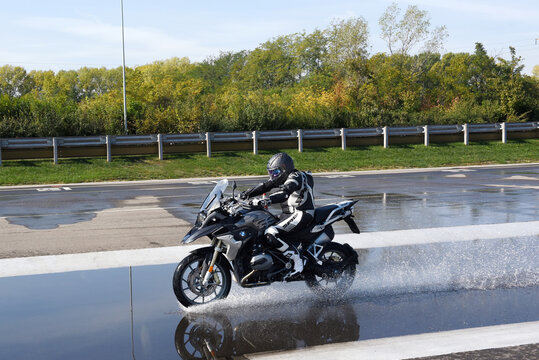 Rider doing aquaplaning tests on a motorbike