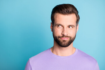 Photo of young attractive young man think curious dream dreamy look empty space isolated over blue...