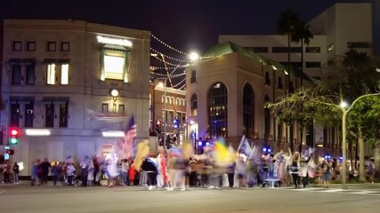 Fast moving timelapse traffic light trails on downtown Rodeo drive nightlife scene