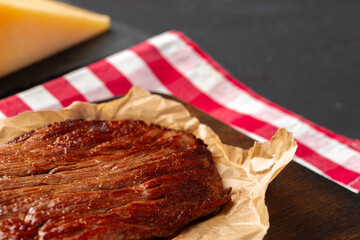 Grilled beef steak served on plate close up