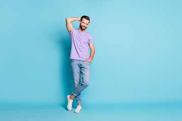 Fototapeta na wymiar Full length photo of young handsome man happy smile confident successful isolated over blue color background