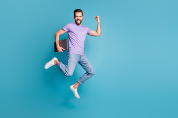 Full length body size photo of jumping high businessman with computer gesturing like winner smiling...