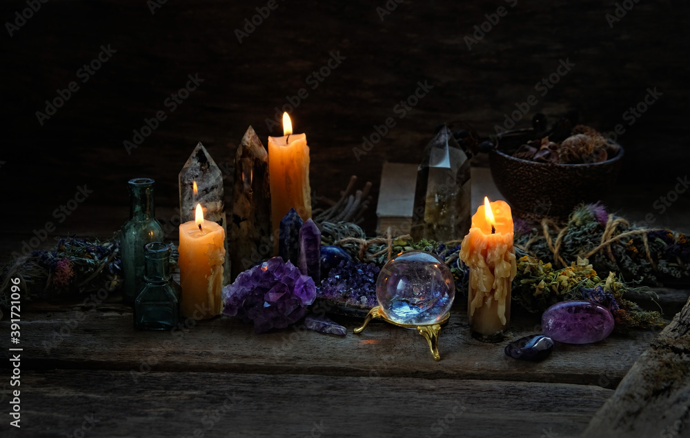 Wall mural candles, floral cleansing bundles, magic things, gemstones minerals on dark rustic background. heali