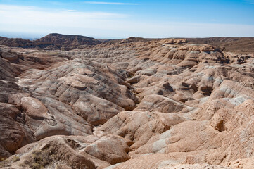 Scenic landscape of hills (like mars) with amazing stone formations in Altyn-Emel National Park, Kazakhstan