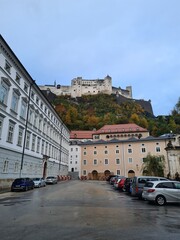 Naklejka premium The fortress Hohensalzburg is resting on a high cliff in the city center of Salzburg, Austria.