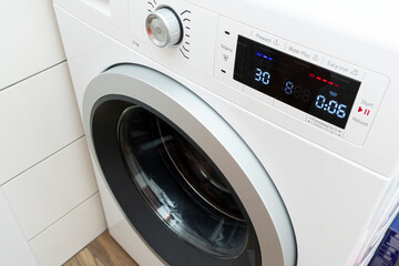 Modern silver washing machine close up
