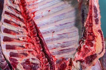 Close up rib meats hanging in the slaughterhouse, Meat industry.