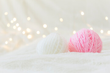 Fototapeta na wymiar Balls of knitting thread lie on a light background.