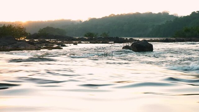 Sunset over the river on the Amazonian forest