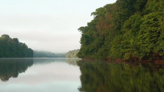 Sunset over the river on the Amazonian forest