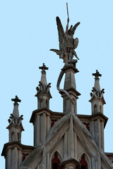 Fototapeta na wymiar Sculpture of Saint George on top of St. Nicholas Roman Catholic Cathedral in Kyiv Ukraine