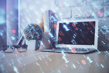 Double exposure of desktop computer and technology theme hologram. Concept of software development.