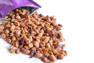 closed up of mixed assortment roasted peanut, cashew, pecan hazelnut a snack fruits, isolated on white background for texting.   