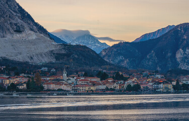 golden sunset light in the winter afternoon, stunning view of a colorful village surrounded by mountains.Lake Maggiore, Piedmont, Italian Lakes, Italy