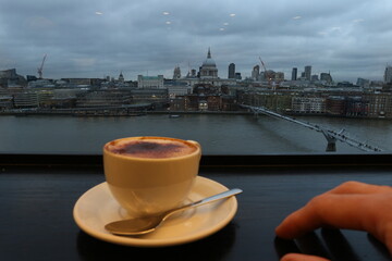 The view to the Thames River, from the cafe inside a modern art gallery, on a cold evening, during the winter.