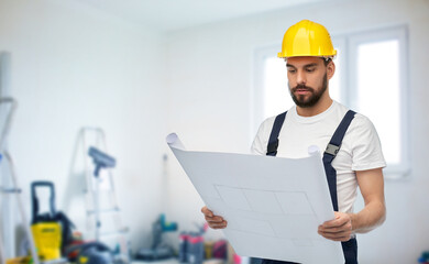 repair, construction and building concept - male worker or builder in helmet with blueprint over room with equipment on background