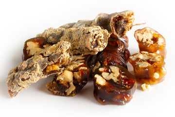Walnuts on a string dipped in starch grape molasses. Churchkhela. Walnut sujuk.