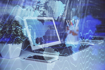 Financial graph colorful drawing and table with computer on background. Multi exposure. Concept of international markets.