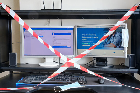 Work from home by TeamViewer in PC. Coronavirus quarantine at the enterprise and in the office is blocked by a red and white signal tape - New York, USA, 04 01 2020