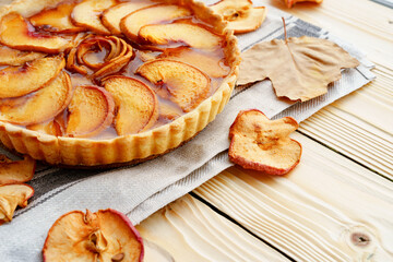 Close up of an apple tart pie on wooden table