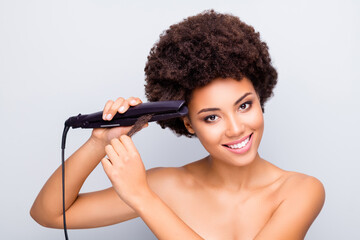 Close-up portrait of her she nice-looking attractive cheerful cheery wavy-haired girl ironing straightening curls hair anti mess keratin treatment isolated on light white gray color pastel background