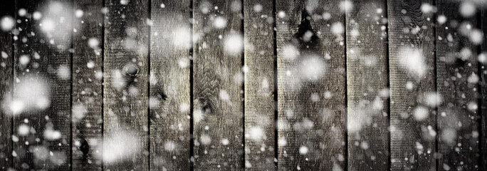 Christmas winter background - old wooden boards with snowflakes