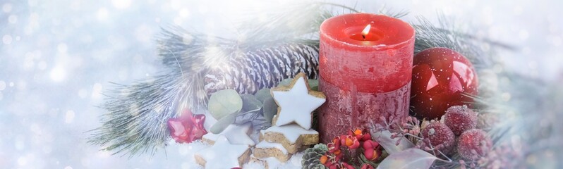 Christmas background banner - advent candle in the snow with magic bokeh lights - copy space,...