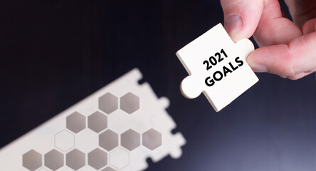 Business, Technology, Internet and network concept. Young businessman shows the word: 2021 goals
