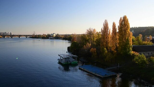 Nice evening panoramic view of Dnipro river with island Ostriv Malyy and bridge from Paton bridge in Kiev, Ukraine
