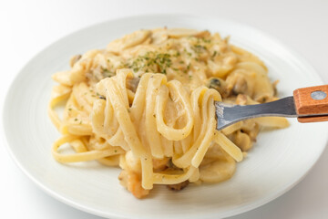 Creamy pasta on white background
