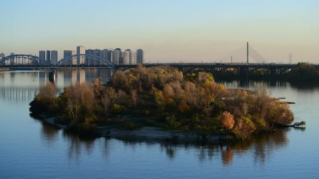 Nice evening panoramic view of Dnipro river with island Ostriv Malyy and bridge from Paton bridge in Kiev, Ukraine