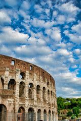 Fototapeta premium The Colosseum and the homonymous square on a summer day, Rome, Italy
