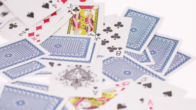 playing cards are scattered on a white background. cards for poker