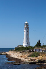 Fototapeta na wymiar lonely lighthouse by the sea
