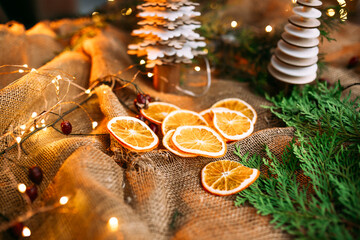 Dried orange slices on the sackcloth with garland