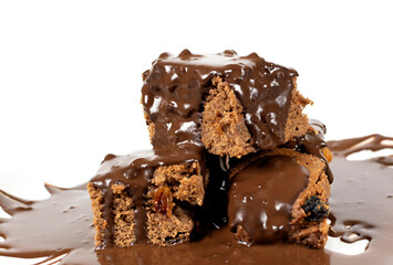 Chocolate dessert poured with chocolate isolated on a white background