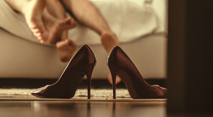 Woman shoes. Couple love. Hotel room. Couple in love. Legs. 