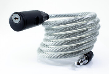 Cable bike lock isolated on white. Bicycle security system with cord close-up photo