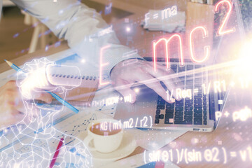 Science formula hologram with man working on computer on background. Education concept. Double...