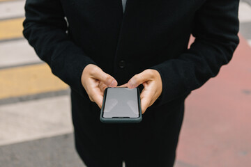 man holding iphone.