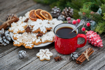 Red cup of coffee with Christmas gingerbread. New Year's still life.