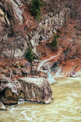 River with rapids and cold winter mountain landscape