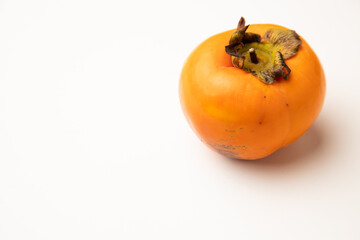 Persimmon fruit on white background