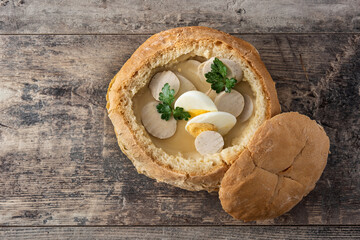 Zurek. Traditional Polish soup on wooden table. Top view