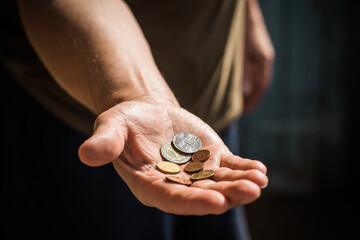 Concept of poverty, and destitution, money and coins. Poor people, need a help