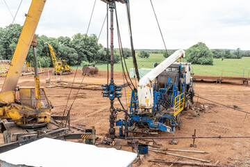 Coiled tubing unit doing well clean out. Wireline equipment hanging from top drive ready to be...
