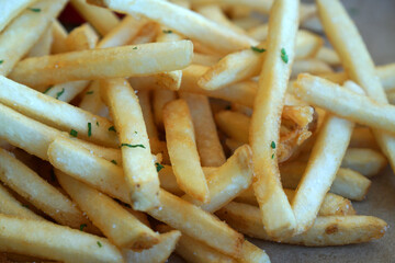 Fast Food scene of  French fries or fried potatoes on white plate - lunch meal at San Franscisco USA