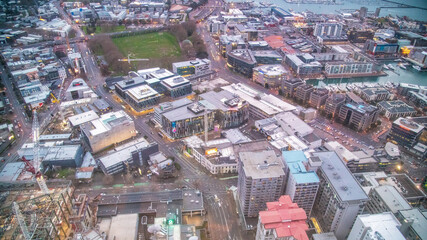 Fototapeta premium AUCKLAND, NZ - AUGUST 26, 2018: Aerial city view from Sky Tower. Auckland skyline at sunset