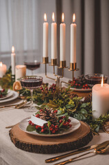 Christmas Eve table with candles and decorations.